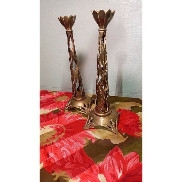 Filigree vintage candle holders. Brass And cast make up to this ,14 inch tall ca